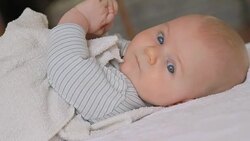 cute baby turns around and looks at the camera Stock Footage