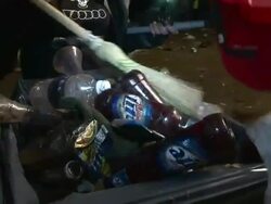 Medium Close Up - People throwing trash into garbage can / New Orleans Louisiana Stock Footage