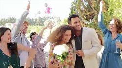 Multi-generation family celebrating  at backyard wedding Stock Footage