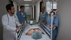 DS Doctor reassuring patient on way to operating room Stock Footage