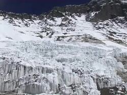 MS PAN three People climbing and walking with equipment in ice and snow on glacier at himalaya / Mt. Everest, Nepal Stock Footage
