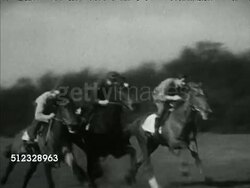 1953: EPSOM DOWNS RACECOURSE: WS Track & building, 'Epsom' sign on freestanding pole, VS Thoroughbred race horses being trained, three racing in field, trainer Walter Nightingale holding reins & talking to Near Star (owned by Sir Bracewell Smith). Instructional Video
