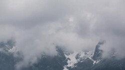 turbulent clouds covering alps peaks Stock Footage