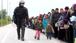 CLEAN : Mounted police escort migrants to Slovenian refugee camp News Clip