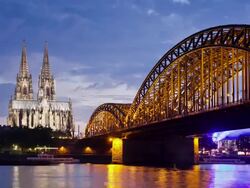 WS T/L View of Cologne Cathedral with Hohenzollern Bridge and Rhine river at dusk / Cologne, North Rhine Westphalia, Germany    Stock Footage