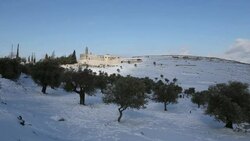 Mar Elias Monastery with olive trees in winter snow, Jerusalem Stock Footage