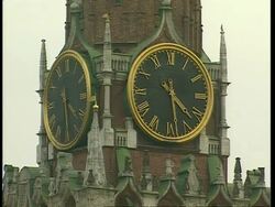 CU Spasskaya clock tower in Kremlin with 2 faces reading 4:28, Moscow Stock Footage