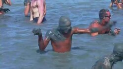 Time to get dirty for carnival goers as they dance in mud Instructional Video