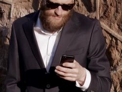 Good looking man with beard using his smartphone. Stock Footage