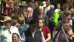 Cowboy hats and saddles for sale at trade fair News Clip