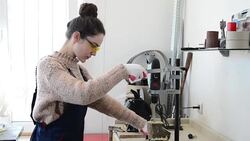 Young woman in a carpenter workshop Stock Footage