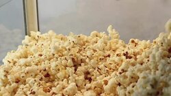 Popcorn Falling in to Cabinet (Slow-Mo) Stock Footage