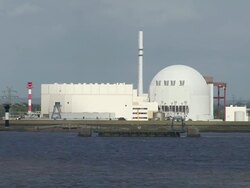 WS View of atomic power plant Brokdorf near river Elbe, Schleswig Holstein / Hamburg, Germany Stock Footage