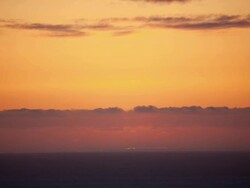 WS T/L View of Sunset in horizon over ocean / Big Sur, California, United States Stock Footage