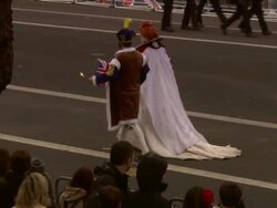 ATMOSPHERE: Crowd wearing fancy dress at the Royal Wedding Procession Cenotaph Whitehall at London England. (Footage by WireImage Video/GettyImages) Stock Footage