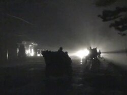 Tractor driving in furious winds illuminated by car headlights, Philippines, Typhoon Parma, 2009 Stock Footage