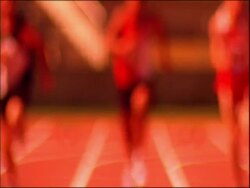 MS tilt up to athletes running to camera on track, dipping for finish, Australia Stock Footage