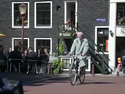 WS People sitting at outdoor cafe while couple on stairs in background / Amsterdam, The Netherlands, Holland Stock Footage