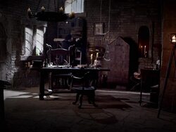 Nostradamus retrieves a book from a bookshelf. Stock Footage