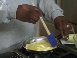 MS TU Dad cooking egg in kitchen / Dallas, Texas, USA Stock Footage