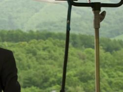 CU PAN Shot of television news crews working outside during G8 meeting / Hokkaido Toyako, Japan Stock Footage