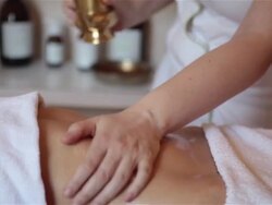 The masseuse does massage girl on belly. Stock Footage