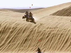 WS ZI PAN Group of ATVs rides acrosing sand dunes / Glamis, California, USA Stock Footage