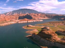 aerial across rock and sandstone formations at Lake Powell  / Page, Arizona, USA Stock Footage