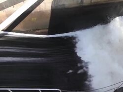 Pan shot Watergate for control and drain stream of water Stock Footage