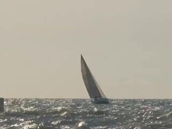 Lighthouse and Sailboat Stock Footage