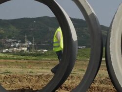 WS PAN Engineer walking across field at the end of working day / Malaga, Andalusia, Spain Stock Footage