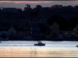 Silhouette Boat Passes Sunrise, Sunset, Dusk, Dawn Stock Footage