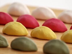 ECU PAN Shot of colorful songpyon (Korea's traditional food) arranged in rows / Seoul, South Korea Stock Footage