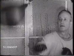 1965: AIR WING 9: HA Angled WS A-4 'Skyhawk' jet approaching USS Enterprise (CVN-65) flight deck, TRACKING Jet flying over deck, MS Rear Admiral Henry L. Miller watching 'wave off', working out w/ speed bag, stationary bicycle, weights.  Cold War, conflic Instructional Video