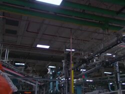 Medium static - A mechanical arm operates in a factory /  Wisconsin, United States Stock Footage