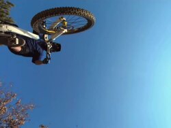 HD Super Slow-Mo: Downhill Biker Jumping Off Rock Stock Footage