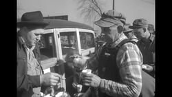 Men in line get coffee from Salvation Army workers during the 1952 Missouri River flood in Omaha, Nebraska News Clip