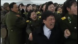 Scenes of mass grief as mourners line streets at funeral for Kim Jong Il News Clip