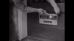 CU Man nailing Whooping cough sign on door / United States Stock Footage