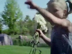 MS SLO MO Girl running with bunch of daisy / Appleton, WI, USA Stock Footage