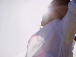 Woman stretching on beach Stock Footage