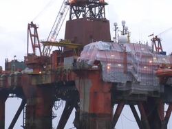 Constuction workers repairing an oil rig Stock Footage