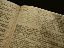 MS Leafing through pages of first edition of King James Bible / England Stock Footage