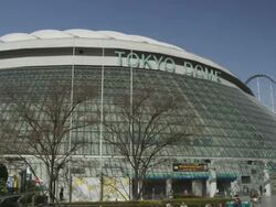 WS PAN View of Tokyo Dome at Korakuen with ferries wheel in background / Tokyo, Tokyo-To, Japan Stock Footage