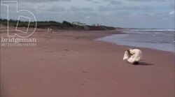 Children playing and adults relaxing on beach, 1908 - reenactment Stock Footage