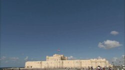 Small, puffy clouds float over the Citadel of Qaitbay in Alexandria, Egypt. Stock Footage