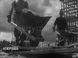 1952: CANADA: CONSTRUCTION: VS Male immigrants working on Ottawa River dam project, shoveling, moving rocks w/ wheel barrows, TD MS Men working w/ shovels & jackhammer on steep slope, TD Men blending soil in bin. Immigration, manual labor, contrac Instructional Video