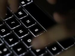 Hand typing a laptop Stock Footage
