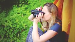 woman traveler looking through binoculars Stock Footage