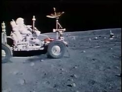 1972 PAN astronaut driving lunar rover on Moon surface / Apollo 16 Stock Footage